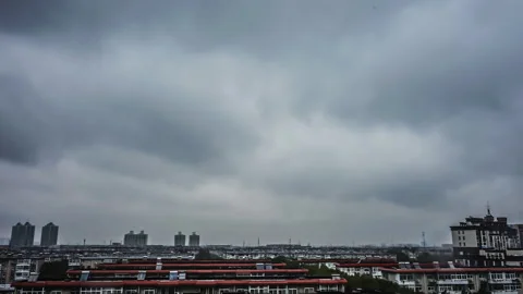 Stormy Skies Dark Clouds Surging 4K Rainy Day Timelapse Stock Footage 320856378