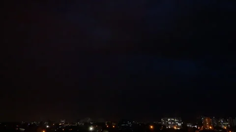 Stormy sky and lightning over night city Stock Footage 279729434