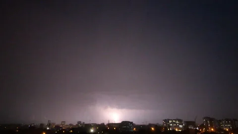 Stormy sky and lightning over night city Stock Footage 279729437