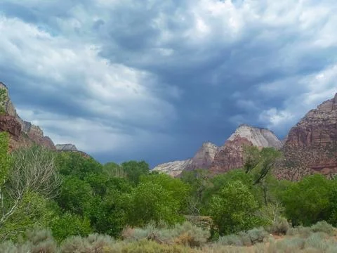 Stormy sky with dark clouds accumulating above Zion National Park Canyon, U.. Stock Photos