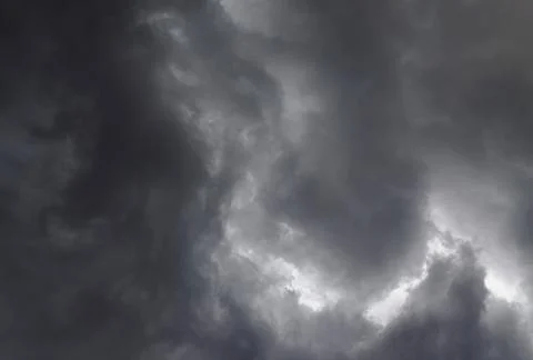 Stormy sky with dark clouds. Dramatic cloudscape before the rain. Stock Photos