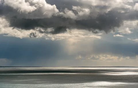 Stormy sky with dramatic clouds and sea. Stormy weather at the ocean Stock-Fotos