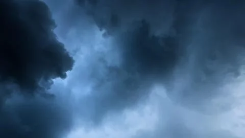 Stormy Sky, Dramatic Dark Clouds, Atmospheric Weather, Intense Blue Tone Stock Photos