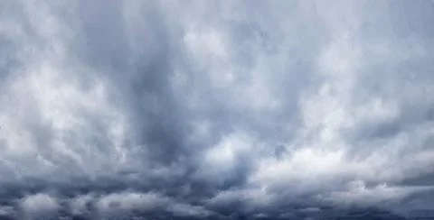Stormy sky with gray clouds before the rain. Stock Photos