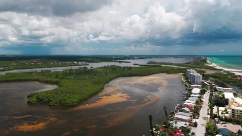 Stormy Sky Over Mangrove Lagoon and Coastal Condo Strip Stock Footage 346373605