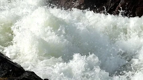 A stormy spring stream is bubbling and foaming. Footage of slow motion. Stock Footage 81727402