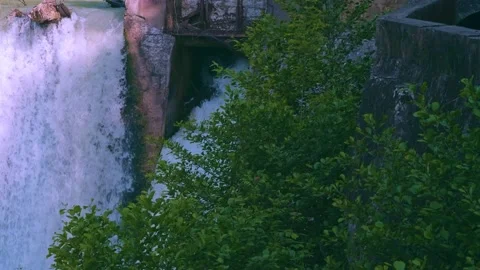 Stormy stream of water with splash from a waterfall at a hydroelectric stat.. Stock Footage 234982024