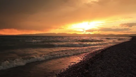 Stormy sunset over a mountain lake. Kyrgyzstan, Son-Kul lake Stock-Footage 80411242