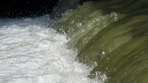 Stormy water flows on a river waterfall in the spring flood Video stock 155567221