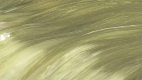 Stormy water flows on a river waterfall in the spring flood Stock Footage 155567229