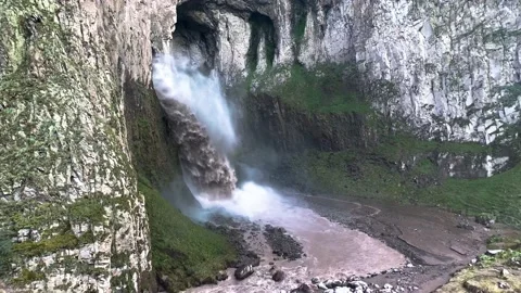 A stormy waterfall between rocks in the Caucasus mountain gorge. Stock Footage 159237569
