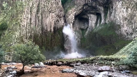 A stormy waterfall between rocks in the Caucasus mountain gorge. Stock Footage 159237716