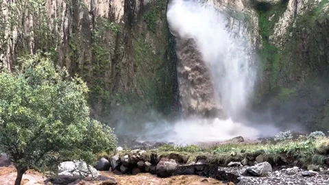 A stormy waterfall between rocks in the Caucasus mountain gorge. 库存影片 159237765