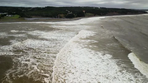 Stormy waves Atlantic ocean in nova scotia, Rainbow Haven Beach aerial view Stock Footage 262081536