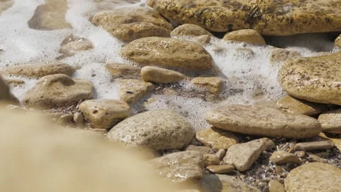 Stormy waves break or splash on the shore of a rocky beach. slow motions. Stock Footage 132908291