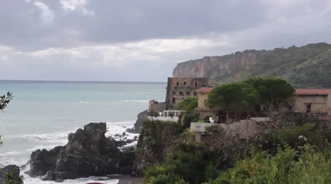 Stormy waves breaking along the cliff Stock Footage 32845535