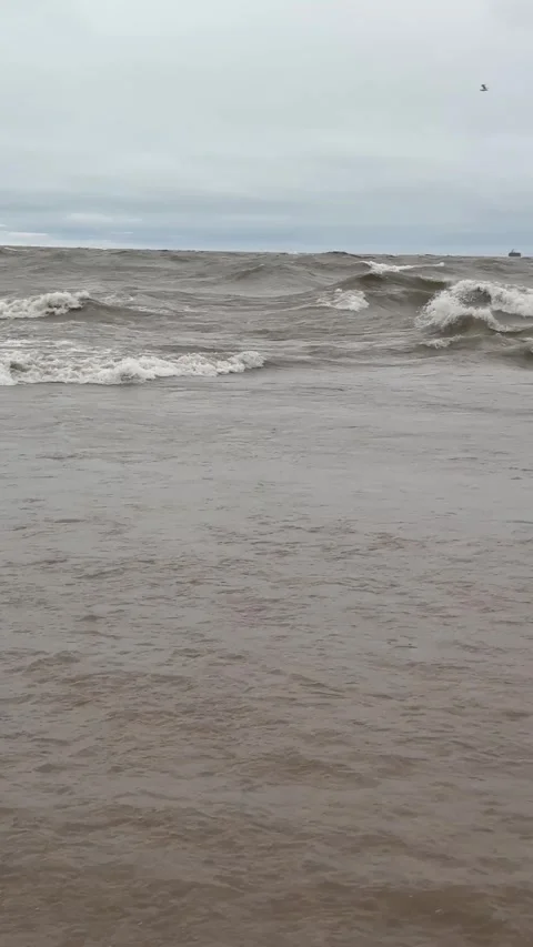 Stormy waves breaking onto the shore Stock Footage 331271101