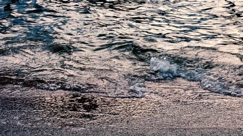 Stormy waves on the red concrete beach Stock Footage 105092465
