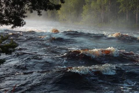 Stormy waves on the river threshold Foto stock