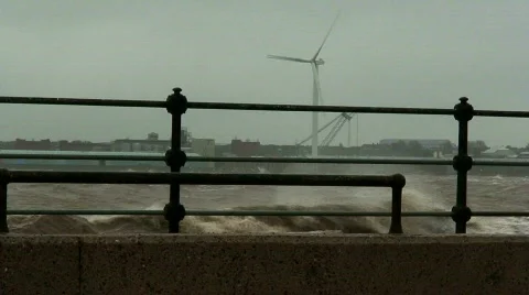 Stormy waves on the river with wind turbines in the background 3 Stock Footage 672584