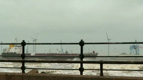 Stormy waves on the river with wind turbines in the background 8 Stock Footage 672607