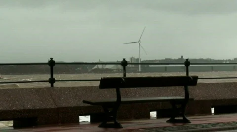 Stormy waves on the river with wind turbines in the background 4 Stock Footage 673441