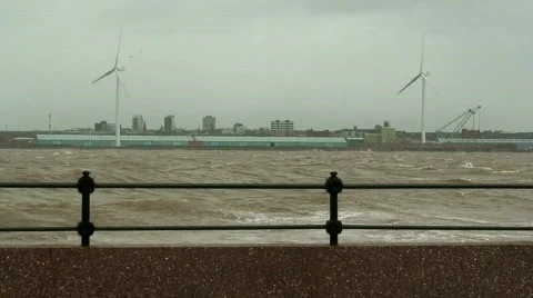 Stormy waves on the river with wind turbines in the background 5 Stock Footage 673470