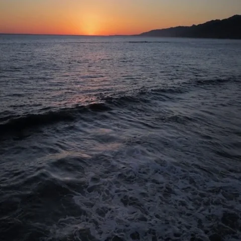 Stormy waves on seashore at sunset Stock Footage 69454586