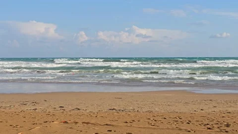 Stormy waves at sunset on the sandy beach of Side Stock Footage 334119089