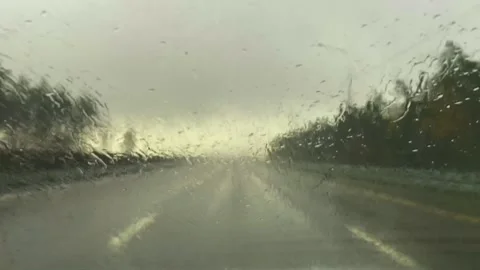Stormy weather causing blurred vision and cautious driving Stock Footage 319953097