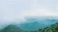 Stormy weather in mountains. Beautiful view of green hills covered with fog 4k or 4k+ Resolution