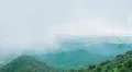 Stormy weather in mountains. Beautiful view of green hills covered with fog HD Footage