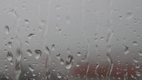 Stormy weather , rain drops falling on the window, thunder and dark gray sky Video stock 158673694
