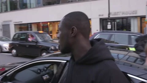 Stormzy and Kate Moss confronted by animal rights protesters at LFW Stock Footage 148664211