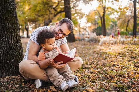 Story Time: Learning and Bonding in Nature Stock Photos