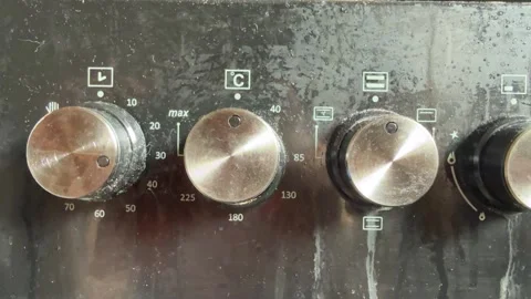 Stove control knobs close up on kitchen cooker panel, home cooking temperature Stock Footage 337119978