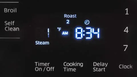Stove display flickering, control panel blinking. Electricity problem Fotos de archivo