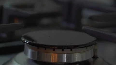 Stove ignites with blue flame in slow motion. Close up. Stove. Stock Footage 241395170