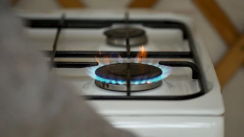 Stove lit with pan Stock Footage 129324636