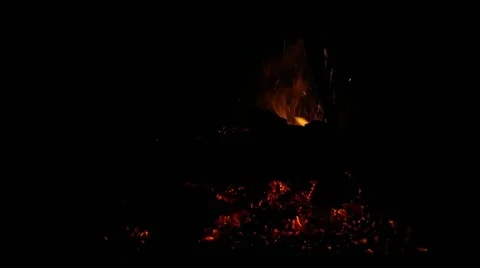 The stove-maker with a poker in winter throws firewood Stock Footage 169223443