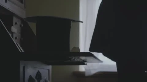 Stovepipe hat on desk Stock Footage 54282961