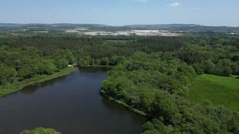 Stover Country Park, S. Devon, England: DRONE VIEWS: Woodland and Stover Lake Stock Footage 242078184
