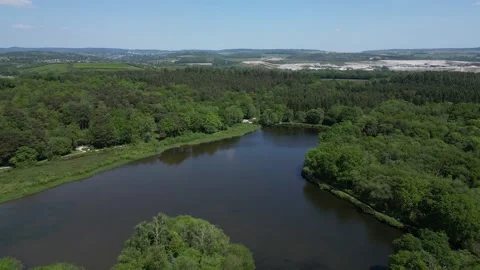 Stover Country Park, S. Devon, England: DRONE VIEWS: Woodland and Stover Lake Stock Footage 242078714