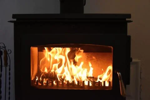 Stoves. Burning fire in the fireplace. Stock Photos