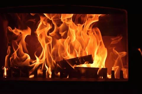 Stoves. Burning fire in the fireplace Stock Photos