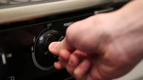 Stovetop knob turned on close up Video stock 61401151