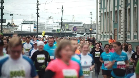 ST.PETERSBURG, RUSSIA - 09.07.2017. People running the marathon in city center Stock Footage
