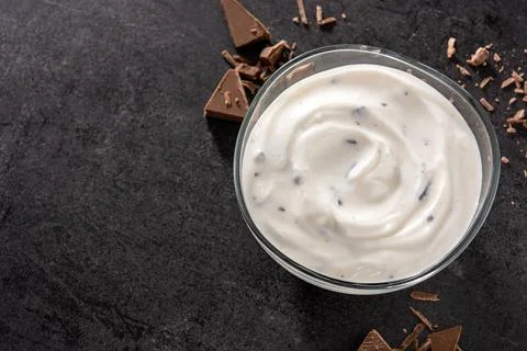 Stracciatella yogurt in transparent bowl Stock Photos