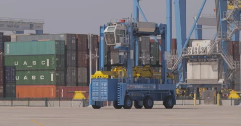 Straddle Carrier Moving A Container (4K) Stock Footage 63085918