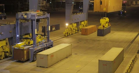 Straddle Carriers Working At Night Port (4K) Stock Footage 63081452